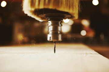 CNC milling machine. Machine tool in wood factory with drilling machines.