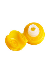 One yellow cap from soft drink bottle on white background.