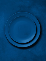 Set of ceramic plates in trend blue classic color
