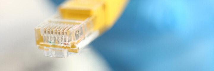 A male hand in blue protective gloves holds