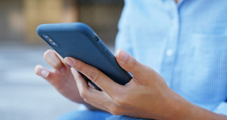 Woman use of cellphone at street