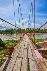 Broken suspension bridge over "Guinaraton River" on Palawan - Philippines