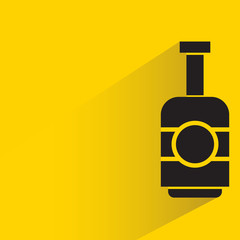 beverage, alcohol bottle with drop shadow yellow background