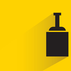 beverage, alcohol bottle with drop shadow yellow background