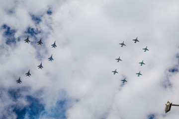 flock of birds flying in blue sky