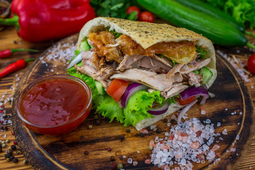 doner kebab on dark wooden kitchen table