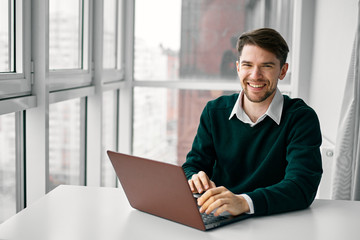 young man working on his laptop at home