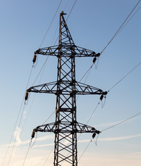 Electric poles at sunset in winter