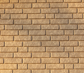 Wall of yellow bricks as an abstract background