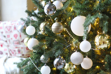 Obraz na płótnie Canvas decorated christmas tree with toys closeup photo