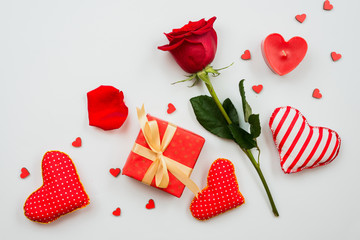 On a white background is a composition of red roses, gifts and hearts. Valentine's Day them
