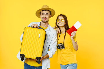 couple painting wall with paint roller