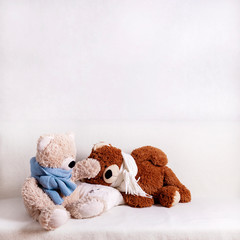 Teddy bears in warm scarves get sick and measure their temperature.