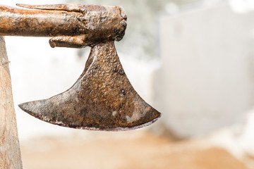 classic and rustic axe hanging on a tree