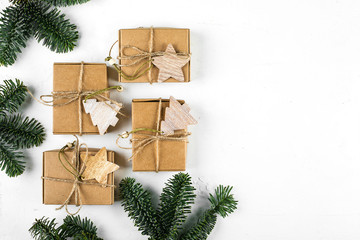 Christmas background. Zero Waste Gift Wrapping Holiday Season Eco-friendly. Craft Boxes with fir branch on white background. Top view, flat lay, copy space