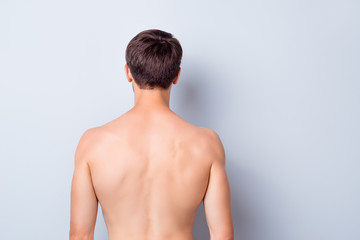 Back rear side photo of handsome man stand feel cool after men spa salon treatment procedure...