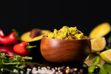 Colourful tasty guacamole with fresh ingredients isolated