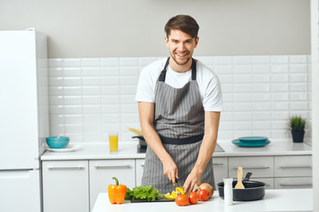 man preparing food in the kitchen