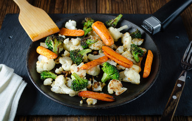 fried vegetables in a pan, vegetarian food, grilled vegetables, fried broccoli cabbage and carrots in a pan