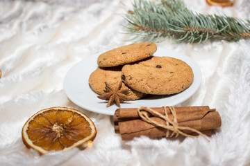 Cozy winter composition. Cookies, cinnamon, and other cute elements