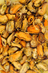 Delicious cooked vinegar preserved pickled mussels background