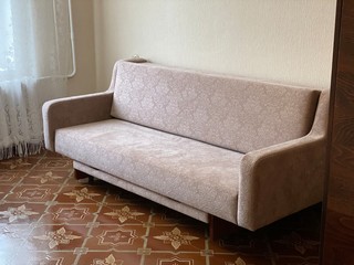 Old soviet sofa in the apartment 