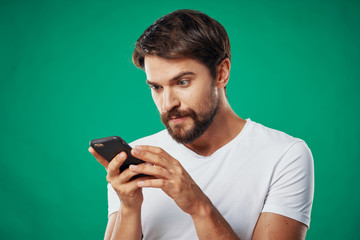 portrait of young man with mobile phone