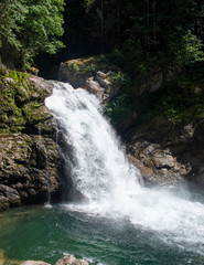 Thundering emerald colored punchbowl waterfall North Fork Sauk River Falls of the north cascades in a rocky gorge off Mountain Loop Highway in Darrington Snohomish county Washington State 