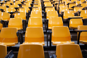 Fototapeta premium Study, the class is empty, full of many orange writing desks.