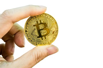 closeup of Digital currency physical golden bitcoin on woman hand isolated on white background.