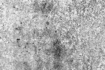 Fototapeta premium Texture of a concrete wall with cracks and scratches which can be used as a background