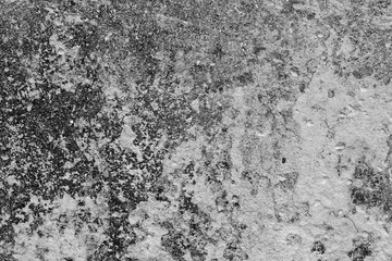 Texture of a concrete wall with cracks and scratches which can be used as a background