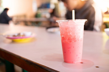 The nectar in the glass is placed on the table after drinking.