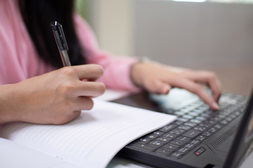 Fototapeta premium closeup of hand typing on laptop keyboard