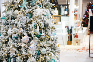Beautiful Christmas tree decorated with balls and other toys.
