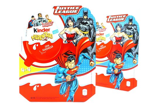 Italy – March 23, 2019: Kinder JOY Merendero JUSTICE LEAGUE Chocolate Eggs. Kinder  is a brand of products made in Italy by Ferrero, Justice League is a Trademark of DC Comics WB SHIELD WBEI