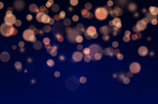 Bokeh lights effect on blue background. Vector Christmas glowing yellow and orange overlay sparkle texture.