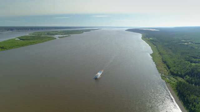 Helicopter epic largest Siberia Lena river shallow wide channel. Lone cruise ship sailing along unique pillars rocks. Beautiful landscape Russia world heritage. Forest tundra Summer open space horizon