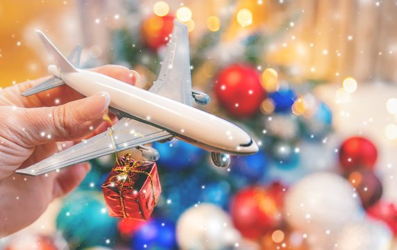 Beautiful christmas background with airplane. Travel concept for christmas and new year. Selective focus.