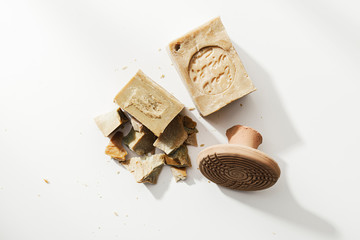 Aleppo soap on a white background with bathroom skin care accessories