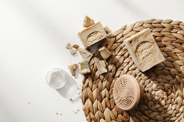 Aleppo soap on a white background with bathroom skin care accessories