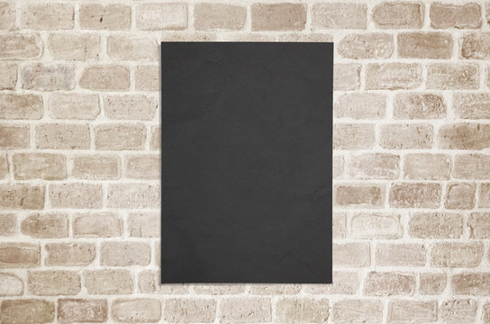 Blank black poster paper glued to the wall mockup