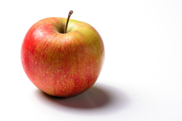 Beautiful fresh red apple on white background with drop shadow. Copy space. 