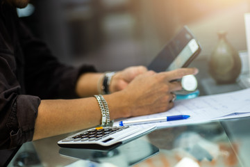 Make a call with a calculator, paying bills for rent,  Finance, debts, financial crisis and store  budget .