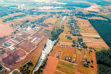 Rural landscape. View from above of countryside in autumn. Aerial view of village and arable fields and forest