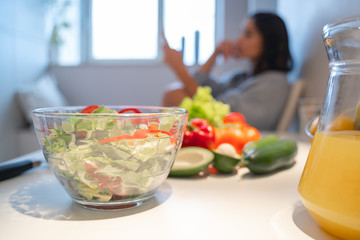 Tasty salad in the glass bowl on the table stock photo