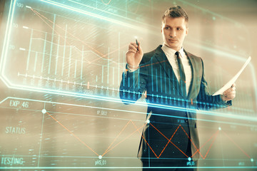 Businessman standing with business theme hologram. Multi exposure. Concept of analysis