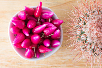 Top View Pink  Acid Pitig&uuml;ey Fruit and cactus on Wooden Background