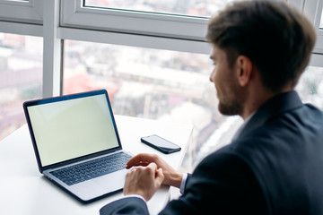 Fototapeta na wymiar businessman working on tablet computer in office