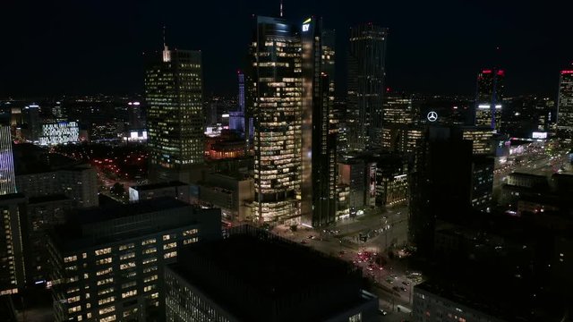 Warsaw Poland. 04. December. 2019. Aerial view of busy streets in downtown Warsaw in City, with bright night lighting. View of the night skyscrapers and streets in the business center of the city. 
